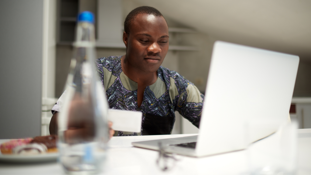 Professional working inside iThrive Coworking Space in Kubwa Abuja with modern desks and high-speed internet.